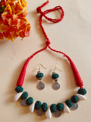 Green cotton balls necklace with cowri